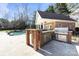 Brick outdoor kitchen with grill and bar at 6049 Bluebird Hill Ln, Weddington, NC 28104