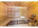 Relaxing cedar wood sauna with built-in bench seating at 6049 Bluebird Hill Ln, Weddington, NC 28104