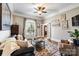 Cozy sitting room with hardwood floors and fireplace at 6049 Bluebird Hill Ln, Weddington, NC 28104