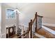 Elegant staircase with wood railing and wrought iron accents at 6049 Bluebird Hill Ln, Weddington, NC 28104