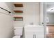 Small bathroom with floating shelves and white vanity at 639 Harrison St, Statesville, NC 28677