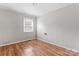 Bright bedroom with wood floors and a window at 639 Harrison St, Statesville, NC 28677