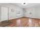 Bright bedroom with hardwood floors and two windows at 639 Harrison St, Statesville, NC 28677