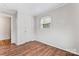 Well-lit bedroom with hardwood floors and a spacious closet at 639 Harrison St, Statesville, NC 28677