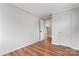 Bedroom with hardwood floors and access to the kitchen at 639 Harrison St, Statesville, NC 28677