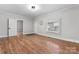 Spacious bedroom with hardwood floors and a window at 639 Harrison St, Statesville, NC 28677