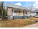 Charming house with yellow porch and grey siding at 639 Harrison St, Statesville, NC 28677