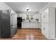 Modern kitchen with white cabinets, stainless steel appliances, and granite countertops at 639 Harrison St, Statesville, NC 28677