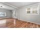 Bright living room featuring hardwood floors and large windows at 639 Harrison St, Statesville, NC 28677