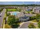 Community aerial view featuring a pool, clubhouse, and surrounding residences at 6605 Central Pacific Ave # 301A, Charlotte, NC 28210