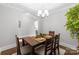 Dining room with modern decor, a rustic dining table, and hardwood flooring at 6605 Central Pacific Ave # 301A, Charlotte, NC 28210