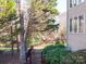 Landscaped backyard with trees and a fence at 7704 Seton House Ln, Charlotte, NC 28277