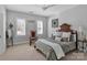 Cozy bedroom with hardwood floors, and a ceiling fan at 7704 Seton House Ln, Charlotte, NC 28277