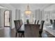 Elegant dining room featuring a large chandelier and bay window at 7704 Seton House Ln, Charlotte, NC 28277