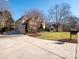 Long driveway leading to a two-car garage at 7704 Seton House Ln, Charlotte, NC 28277