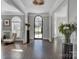 Bright entryway with hardwood floors, arched doorway and decorative accents at 7704 Seton House Ln, Charlotte, NC 28277