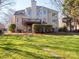 Two story house exterior with deck and stone pathway, nestled amongst trees at 7704 Seton House Ln, Charlotte, NC 28277