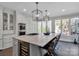 Modern kitchen featuring a large island with seating and stainless steel appliances at 7704 Seton House Ln, Charlotte, NC 28277