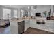 Modern kitchen with white cabinets, a farmhouse sink, and stainless steel appliances at 7704 Seton House Ln, Charlotte, NC 28277