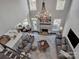 Open living area with double-height ceilings, fireplace, and ample natural light at 7704 Seton House Ln, Charlotte, NC 28277