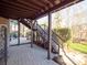 Brick patio with staircase leading to backyard and deck at 7704 Seton House Ln, Charlotte, NC 28277