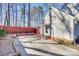 A fenced-in backyard with a concrete patio and small plants adorn the perimeter at 7832 Winterset Dr, Charlotte, NC 28270