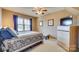 Comfortable bedroom with window and TV at 7832 Winterset Dr, Charlotte, NC 28270