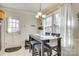 Cozy dining area featuring a modern table, comfortable seating, and natural light at 7832 Winterset Dr, Charlotte, NC 28270