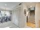 Bright entryway with tiled floors, a dining area and staircase to the second floor at 7832 Winterset Dr, Charlotte, NC 28270