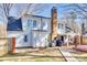 Back exterior of home featuring a patio, brick chimney, and well-maintained siding at 7832 Winterset Dr, Charlotte, NC 28270