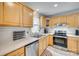 Well-lit kitchen featuring stainless steel appliances and ample counter space at 7832 Winterset Dr, Charlotte, NC 28270