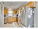 Bright kitchen featuring stainless steel appliances and light wood cabinetry at 7832 Winterset Dr, Charlotte, NC 28270