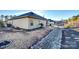 Landscaped backyard with rock drainage system at 859 Accent Se Ave, Concord, NC 28025