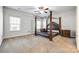 Main bedroom with a large four-poster bed at 859 Accent Se Ave, Concord, NC 28025