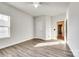 Secondary bedroom with wood flooring and access to hallway at 859 Accent Se Ave, Concord, NC 28025