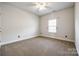 Bright bedroom with carpeted floor and neutral walls at 859 Accent Se Ave, Concord, NC 28025