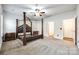 Spacious bedroom with a large four-poster bed and ensuite access at 859 Accent Se Ave, Concord, NC 28025