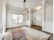 Spacious dining area with hardwood floors and a stylish chandelier at 859 Accent Se Ave, Concord, NC 28025