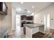 Modern kitchen with dark cabinets, granite countertops and an island at 859 Accent Se Ave, Concord, NC 28025