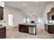 Open kitchen with island, stainless steel appliances and vaulted ceiling at 859 Accent Se Ave, Concord, NC 28025