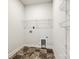 Laundry room with wire shelving and tile flooring at 859 Accent Se Ave, Concord, NC 28025