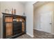 Dark wood bar cabinet with glass doors and ample storage at 8928 Morning Mist Rd, Charlotte, NC 28215