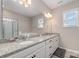 Bathroom with granite countertop, double sinks, and a large walk-in shower at 8928 Morning Mist Rd, Charlotte, NC 28215