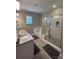 Elegant bathroom with double vanity, soaking tub, and shower at 8928 Morning Mist Rd, Charlotte, NC 28215