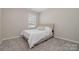 Cozy bedroom with neutral walls and carpeted floors at 8928 Morning Mist Rd, Charlotte, NC 28215