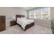 Spacious bedroom with carpeted floors and large windows at 8928 Morning Mist Rd, Charlotte, NC 28215