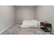 Simple bedroom with a double bed and a small side table at 8928 Morning Mist Rd, Charlotte, NC 28215