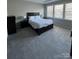 Main bedroom with plush carpet and ample natural light at 8928 Morning Mist Rd, Charlotte, NC 28215