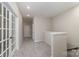 Upstairs hallway with carpet and french doors at 8928 Morning Mist Rd, Charlotte, NC 28215