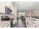 Modern kitchen with stainless steel appliances and granite countertops at 8928 Morning Mist Rd, Charlotte, NC 28215